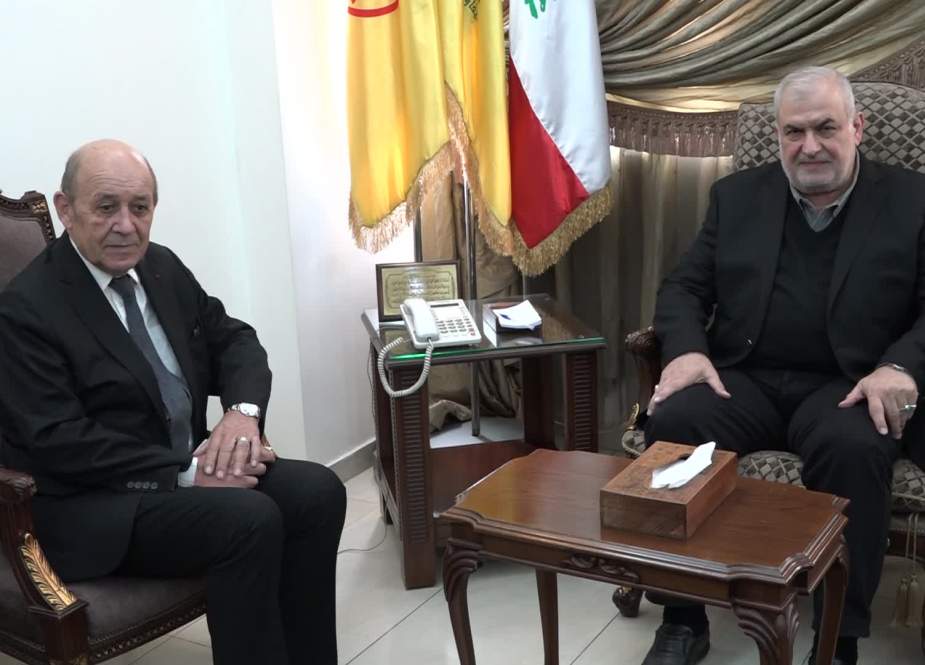 Head of Loyalty to Resistance bloc MP Mohammad Raad with the French presidential envoy Jean-Yves Le Drian at the bloc’s headquarters in Haret Hreik.
