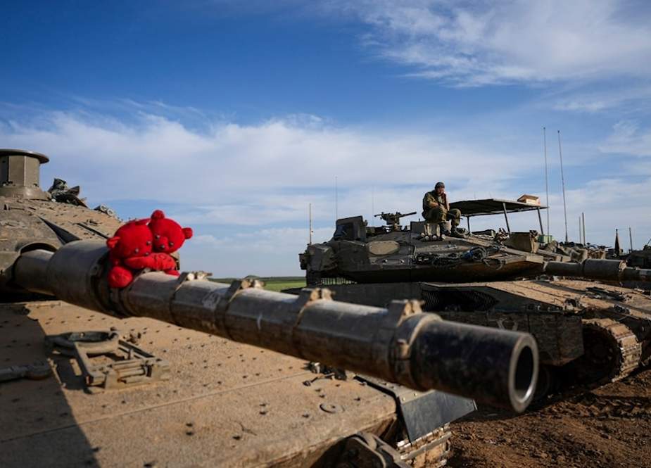 Israeli occupation tanks parked in a staging area near the Gaza Strip border in southern occupied Palestine