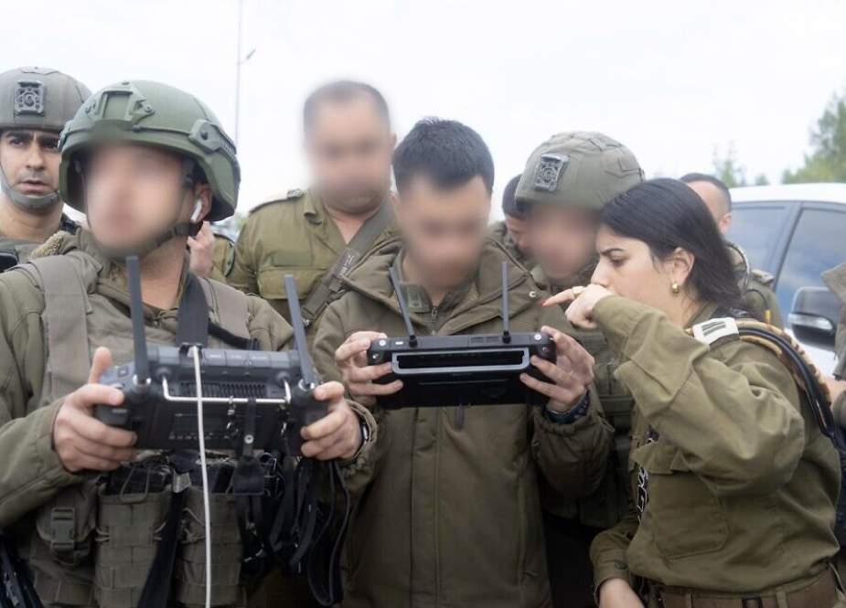 Israeli occupation troops operate a drone at the scene of the shooting attack near the settlement of Dolev
