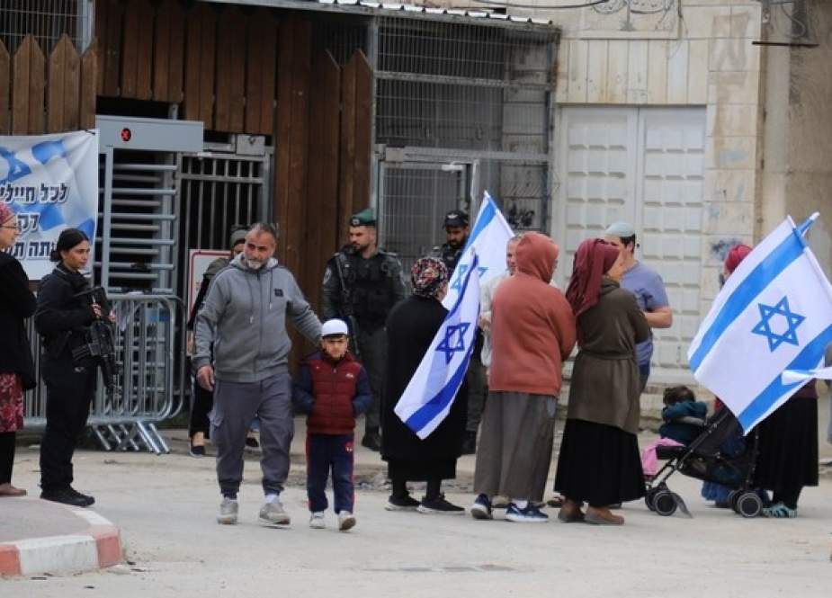 Jewish settlers hold a demonstration in the West Bank city of Hebron