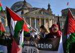 People with Palestinian flags protest in Berlin, German