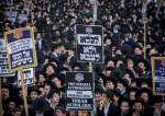 Ultra-Orthodox protesters demonstrate against the Israeli occupation army draft in Al-Quds