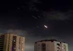 Iranian drones and missiles launched at the Israeli-occupied territories are seen over Tel Aviv