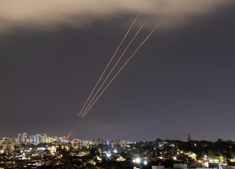 Israeli Iron Dome launches interceptors toward incoming Iranian missiles as seen from Ashkelon in southern occupied Palestine