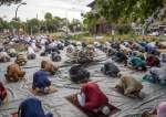 Muslims celebrate Eid al-Fitr, which marks the end of Ramadan, at Largo Preneste in Rome, Italy
