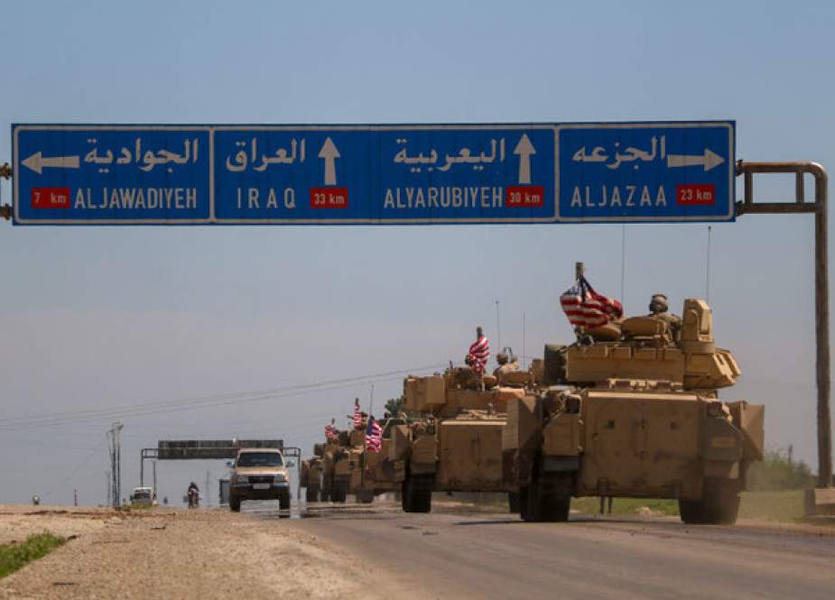 US reinforcements travel in a convoy last August in eastern Syria