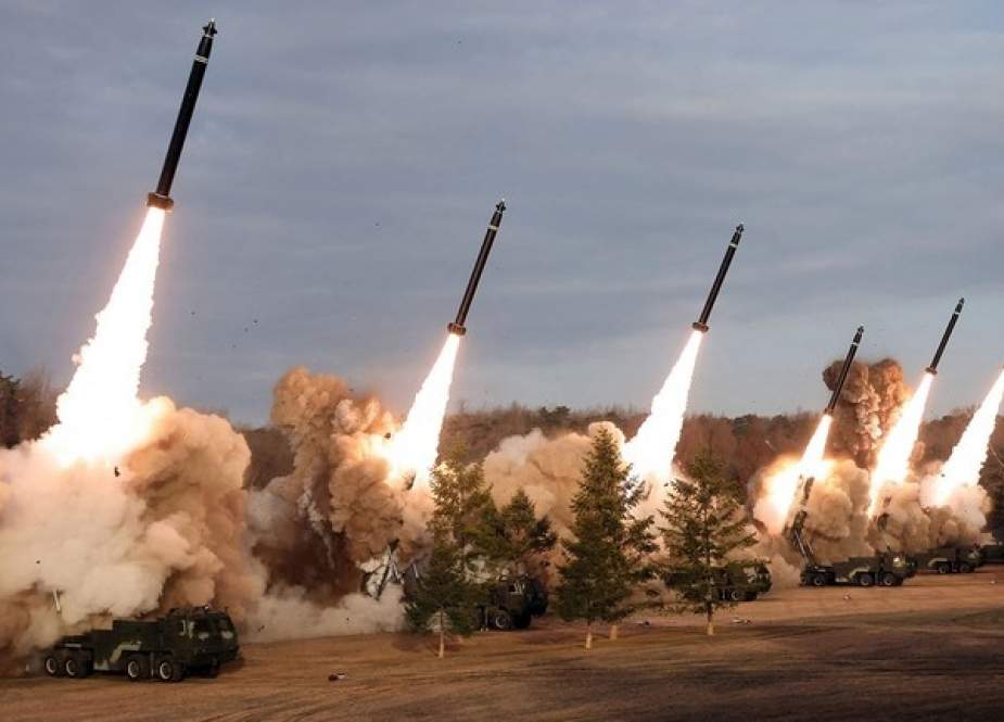 North Korean forces fire a rocket salvo during a drill