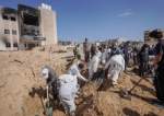 Palestinian-health-workers-unearth-a-body-buried-by-Israeli-forces-inside-the-Nasser-hospital-compou