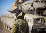 IDF stands by a tank in Syria border