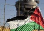 A Palestinian flag on the fence of Israel