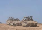 Israeli soldiers drive APC near Gaza Strip