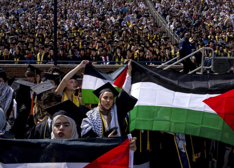 Pro-Palestinian protesters shout slogans at the University of Michigan’s spring commencement ceremony  at Michigan Stadium in Ann Arbor, Michigan