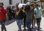 A body is brought to Al-Ahli Arab Hospital in Gaza City for burial following an Israeli attack