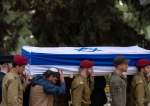 IOF soldiers carry a flag-draped casket during the funeral of another occupation soldier