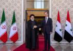 Syrian President Bashar Al-Assad and Iranian President Ebrahim Raisi