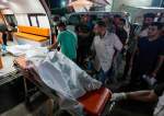 Palestinian medics move dead bodies killed in the Israeli bombardment of al-Zawaida in the central Gaza Strip to the morgue of al-Aqsa Hospital in Deir al Balah, Gaza Strip