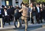 Israeli occupation police assault a Haredi Jew protesting the conscription law
